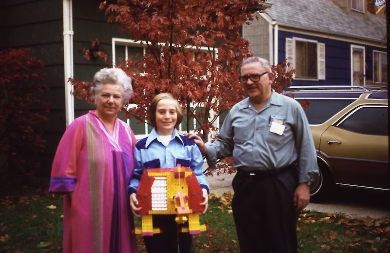 Picture of Paul Fernhout, his parents, and a robot he built from Togls toy blocks from around 1976