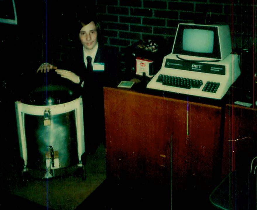 Picture of Paul Fernhout and a robot he built at the Robotic Futures Expo in 1980